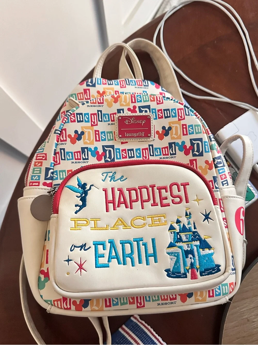 Disneyland Loungefly Cream 'The Happiest Place on Earth' Backpack (used)